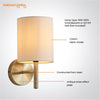 Tatum Decorative Contemporary Antique Brass E14 LED Compatible Wall Light with a Cream Fabric Drum Shade