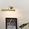 Modern Adjustable Twin Picture Wall Light in an Antique Brassed Effect Finish