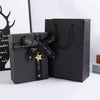 "Classy Black Gift Bags with Silver Tissue Paper - Perfect for Groomsmen Proposals!"